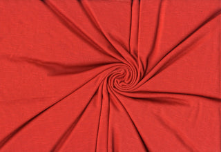 Soft stretch slub jersey knit in 100% polyester, ideal for DIY apparel, crafts, and sublimation. RUST