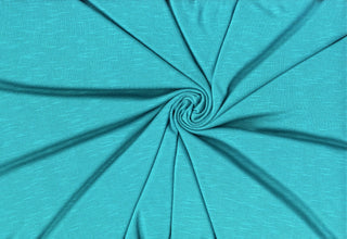 Soft stretch slub jersey knit in 100% polyester, ideal for DIY apparel, crafts, and sublimation. JADE