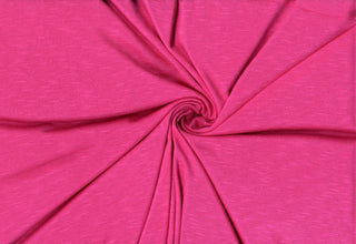 Soft stretch slub jersey knit in 100% polyester, ideal for DIY apparel, crafts, and sublimation. FUCHSIA