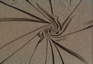 Soft stretch slub jersey knit in 100% polyester, ideal for DIY apparel, crafts, and sublimation. OLIVE