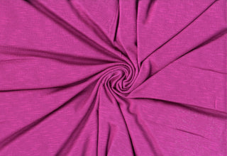 Soft stretch slub jersey knit in 100% polyester, ideal for DIY apparel, crafts, and sublimation. MAGENTA