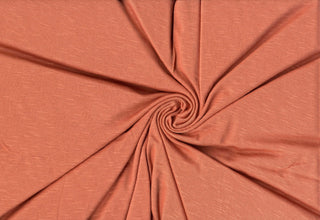 Soft stretch slub jersey knit in 100% polyester, ideal for DIY apparel, crafts, and sublimation. APRICOTE