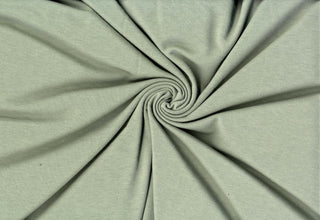 Soft rayon hacci slub stripe knit with lightweight stretch, ideal for shirts, blouses, and crafts. ARTICHOKE