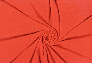 Soft ribbed hacci knit with stretch, perfect for cozy apparel, blouses, and DIY sewing projects. RUST