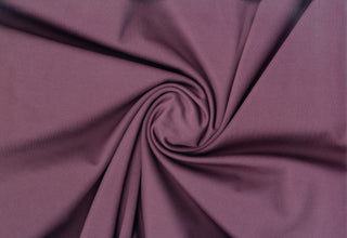 Soft faux knit suede with scuba stretch, perfect for sewing apparel, crafts, and décor. EGGPLANT