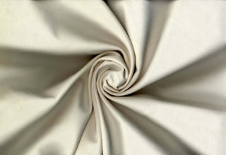 Soft faux knit suede with scuba stretch, perfect for sewing apparel, crafts, and décor. IVORY