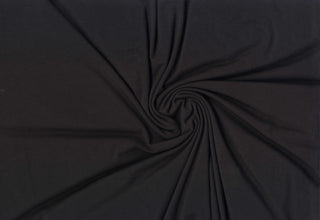 Lightweight stretch rayon fabric with modal-like softness and flowing texture for sewing projects 185 GSM