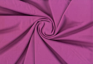 Stretch knit fabric featuring subtle gaberdine twill groove texture with body-contouring flexibility MAGENTA