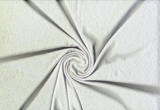 Lightweight Hamilton knit with 4-way stretch, soft drape, and gauze-like texture for apparel and crafts.