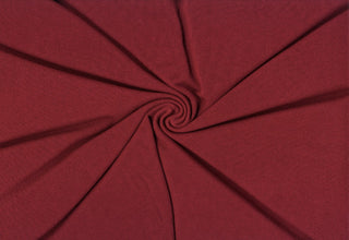 Hacci sweater knit with cotton-spandex blend, cozy stretch fabric ideal for warm fall and winter apparel. MERLOT