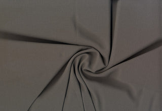 Crepe Bubble Koshibo Diamond fabric with 2-way stretch and textured sheen, ideal for fashion and crafts. CHARCOAL