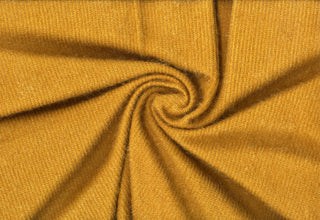 Shaggy knit fabric with soft, plush ridges and faux fur texture, ideal for cozy sweaters and bold DIY crafts