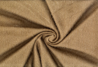 Shaggy knit fabric with soft, plush ridges and faux fur texture, ideal for cozy sweaters and bold DIY crafts