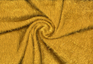 Shaggy faux fur fabric with a fluffy eyelash texture featuring long, wispy strands and soft ridges