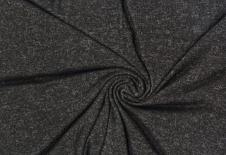 Stretchy heathered knit with a brushed surface and delicate faux pashmina-inspired texture