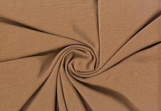 Lightweight woven fabric featuring a soft, textured surface with an airy, flowing, elegant drape