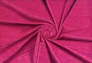 Soft corduroy-like knit fabric with plush ribbed texture and a velvety brushed surface for sewing projects MAGENTA