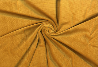 Stretch knit fabric with soft corduroy ribs, plush ridge texture, and a luxurious brushed, velvety finish