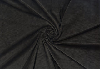 Stretch knit fabric with soft corduroy ribs, plush ridge texture, and a luxurious brushed, velvety finish