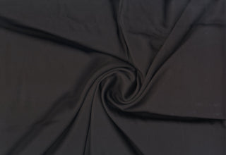 Soft matte sateen fabric with light stretch and smooth texture, ideal for crafting sleek garments