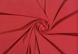 Soft shiny knit fabric with smooth crinkle texture, lightweight flowing drape, and flexible stretch PORT