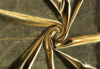 Stretchy lame fabric with glossy, mirror-like finish and sleek, fluid texture for flexible designs