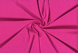 Soft 4x2 brushed rib knit fabric with plush ridges and flexible four-way stretch for sewing and crafts