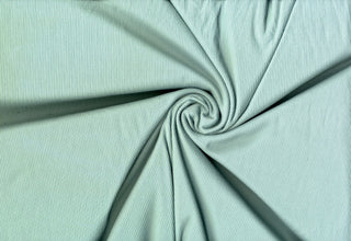 Soft ribbed 2x1 knit fabric with plush brushed texture and flexible 4-way stretch for sewing projects
