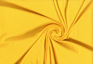 Soft ribbed 2x1 knit fabric with plush brushed texture and flexible 4-way stretch for sewing projects