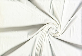 Soft ribbed 2x1 knit fabric with plush brushed texture and flexible 4-way stretch for sewing projects OFF WHITE
