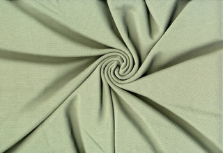 Stretchy waffle knit with a brushed suede feel, perfect for stylish tops, dresses, and activewear