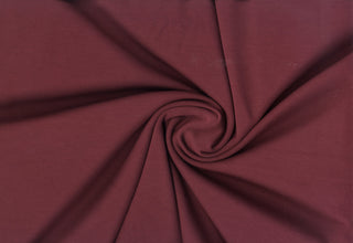 Modal-inspired soft double knit with a fine, smooth surface and subtle brushed  finish, ideal for apparel.