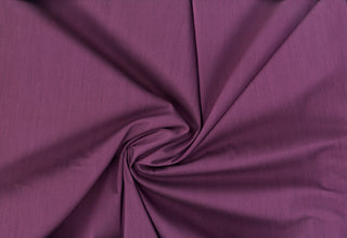 Smooth poplin weave with gentle stretch and minimal surface variation for tailored looks