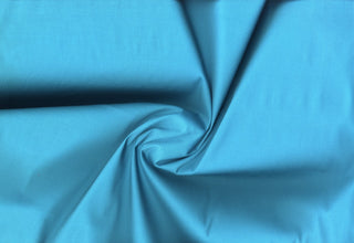 Stretch cotton poplin , with smooth, Flat, crisp surface and breathable weave perfect for fashion and crafts CARRIBEAN BLUE