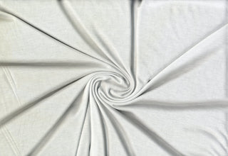 Lightweight jersey knit with soft hand and gentle stretch for fluid draping and easy sewing