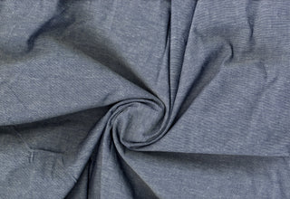 Fine woven surface with delicate heather effect, combining traditional chambray charm with flexible comfort