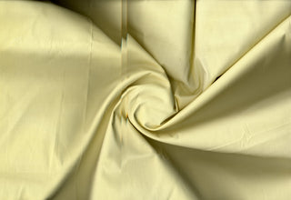 Plain weave cotton with soft stretch and fine, smooth surface ideal for tailored or flowing projects BUTTER