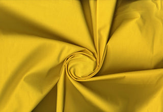 Plain weave cotton with soft stretch and fine, smooth surface ideal for tailored or flowing projects YELLOW