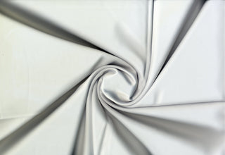 Smooth, glossy satin fabric with a soft, fluid drape and subtle stretch for elegant sewing projects