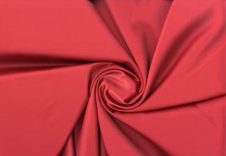 Smooth, glossy satin fabric with a soft, fluid drape and subtle stretch for elegant sewing projects
