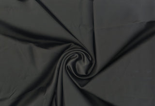 Smooth, glossy satin fabric with a soft, fluid drape and subtle stretch for elegant sewing projects