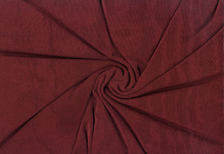 Stretch jersey slinky knit with a soft shimmer finish and flexible, fluid drape for sewing projects
