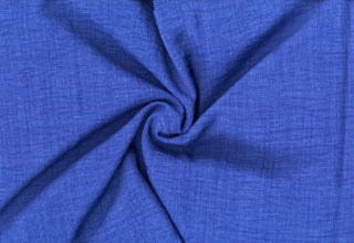 Textured woven fabric featuring a washed linen look with subtle crinkles, perfect for fashion and DIY crafts